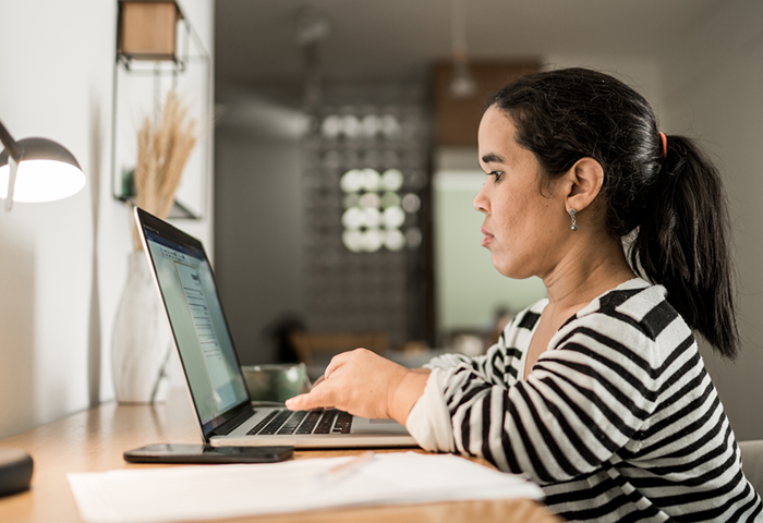 Woman with a laptop working in office